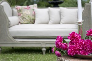 peonies in front of patio furniture
